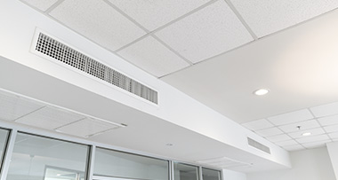 ducted air conditioning installed onto the high wall of an office